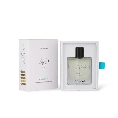 A 50 ml bottle of Zesty Earl Eau de Parfum from Scent Life is showcased in an open white box, emitting citrusy notes akin to Earl Grey tea. The minimalist bottle design featuring a black cap and a small, colorful side design is enhanced by green text declaring it as 100% handmade in Australia.